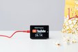 2025-04-10T14:15:07.895Z-YouTube subscriber counter on a white desk next to popcorn.jpg