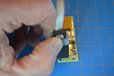 2023-07-13T19:31:38.334Z-adapter-in-hand-fully-engaged-on-PCB-1.JPG