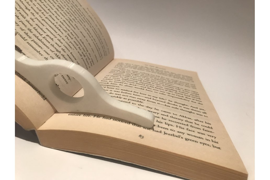 Thumb book page holder