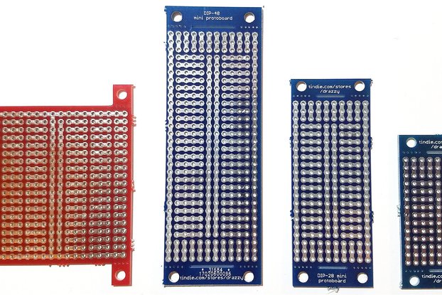 Prototyping board with breakaway mounting tabs
